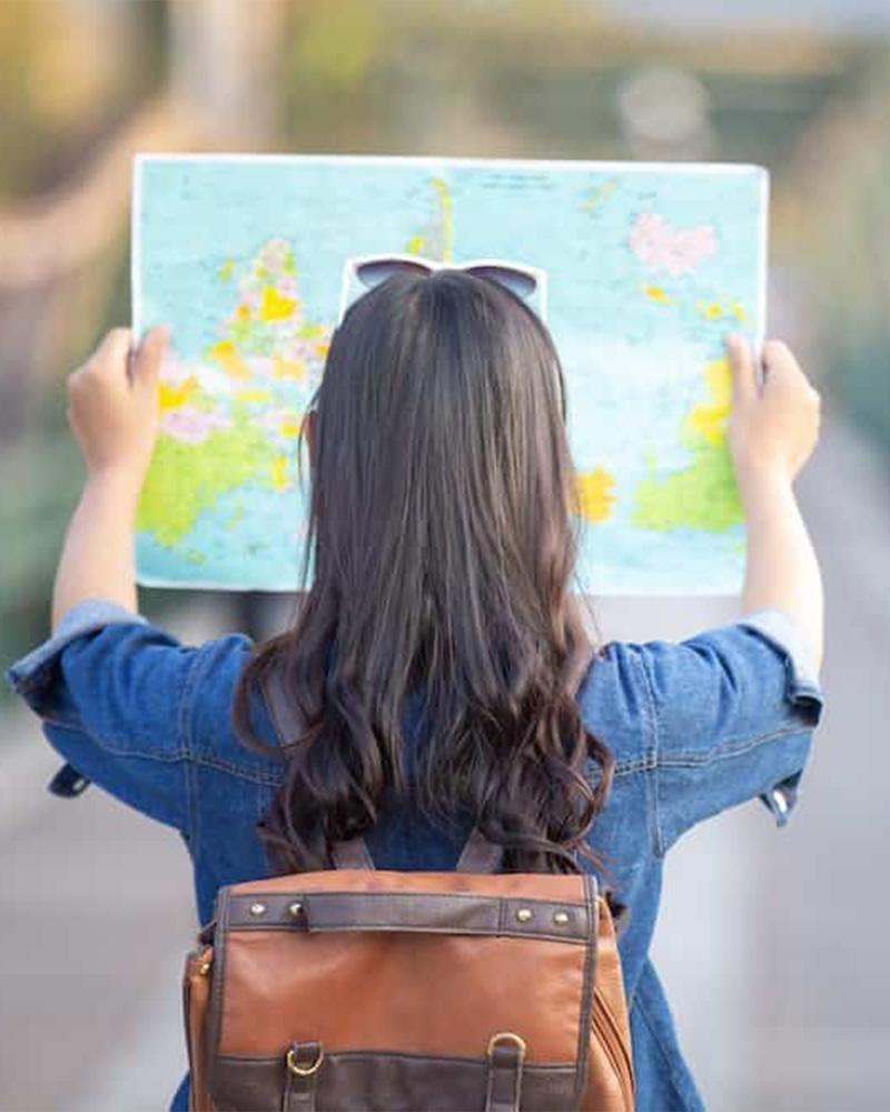 a traveller with paper map